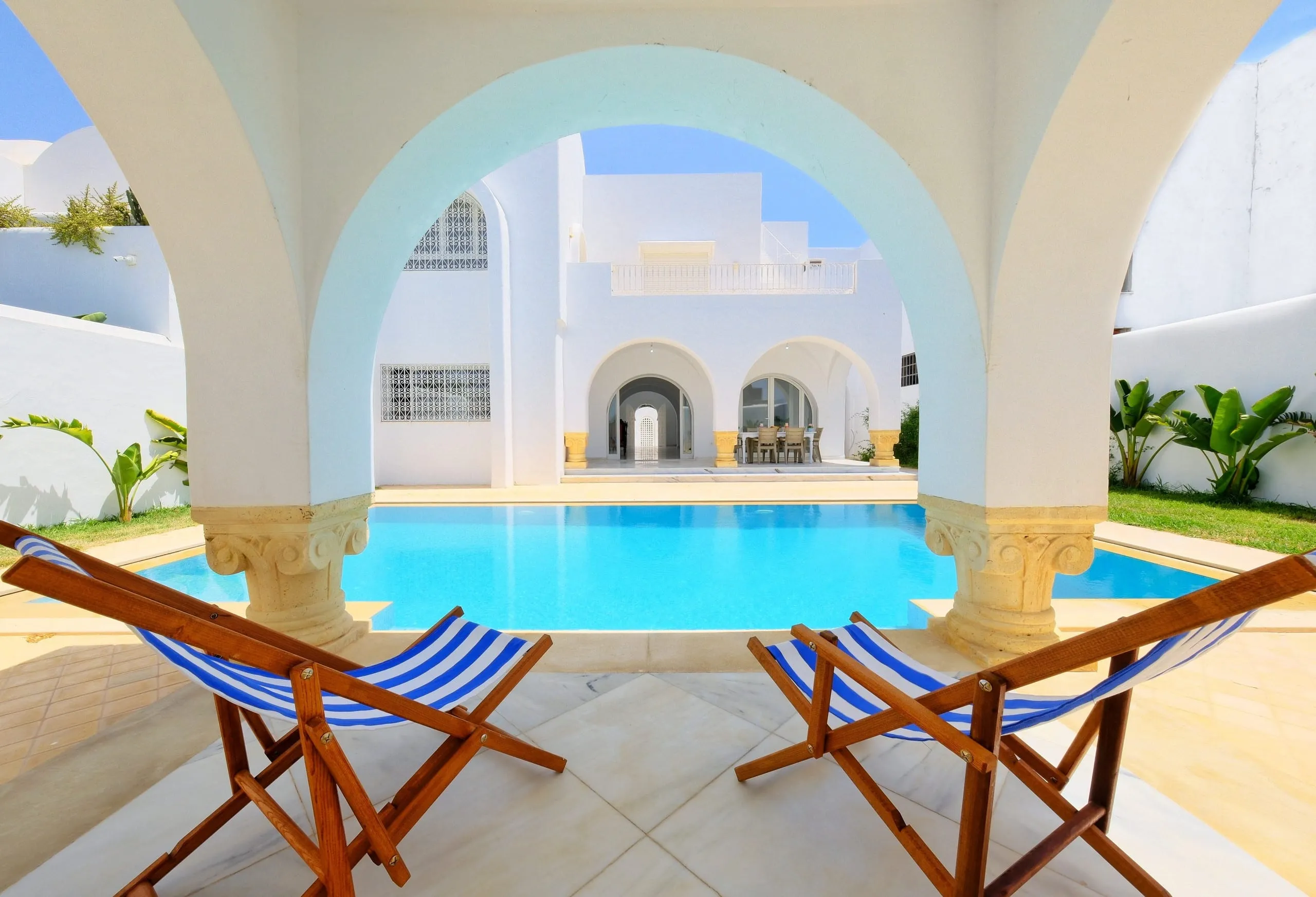 The pool seen through the terrace arches