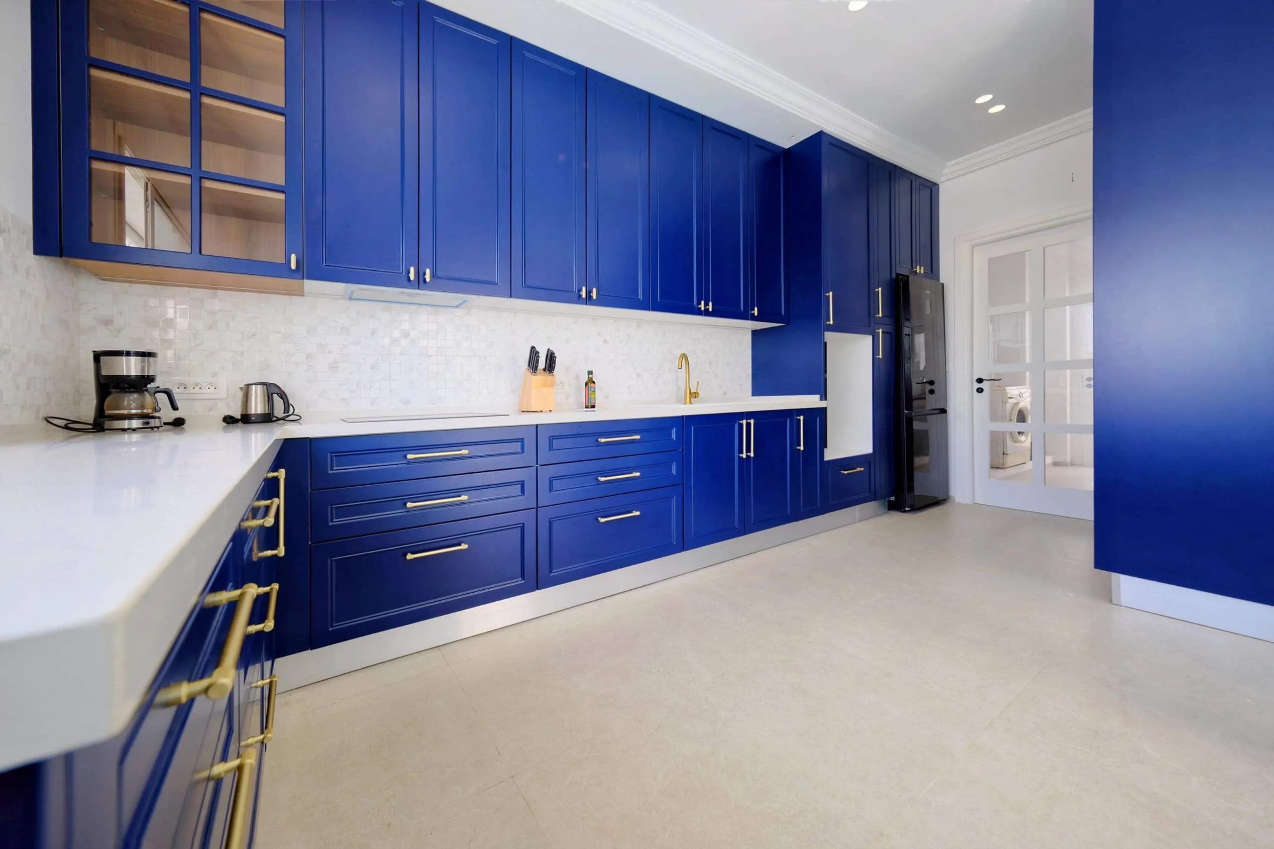 The fully equipped blue kitchen