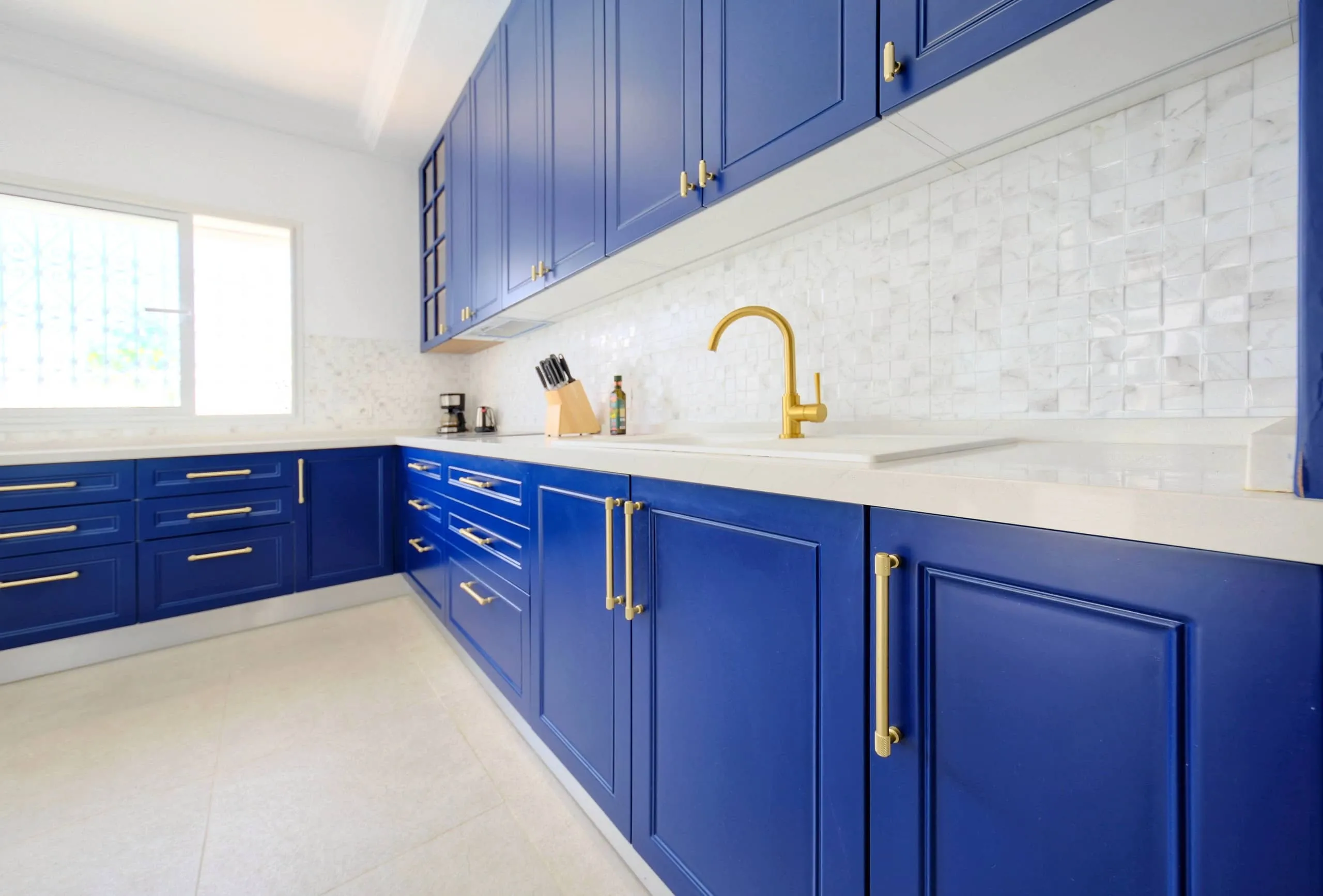 The fully equipped blue kitchen