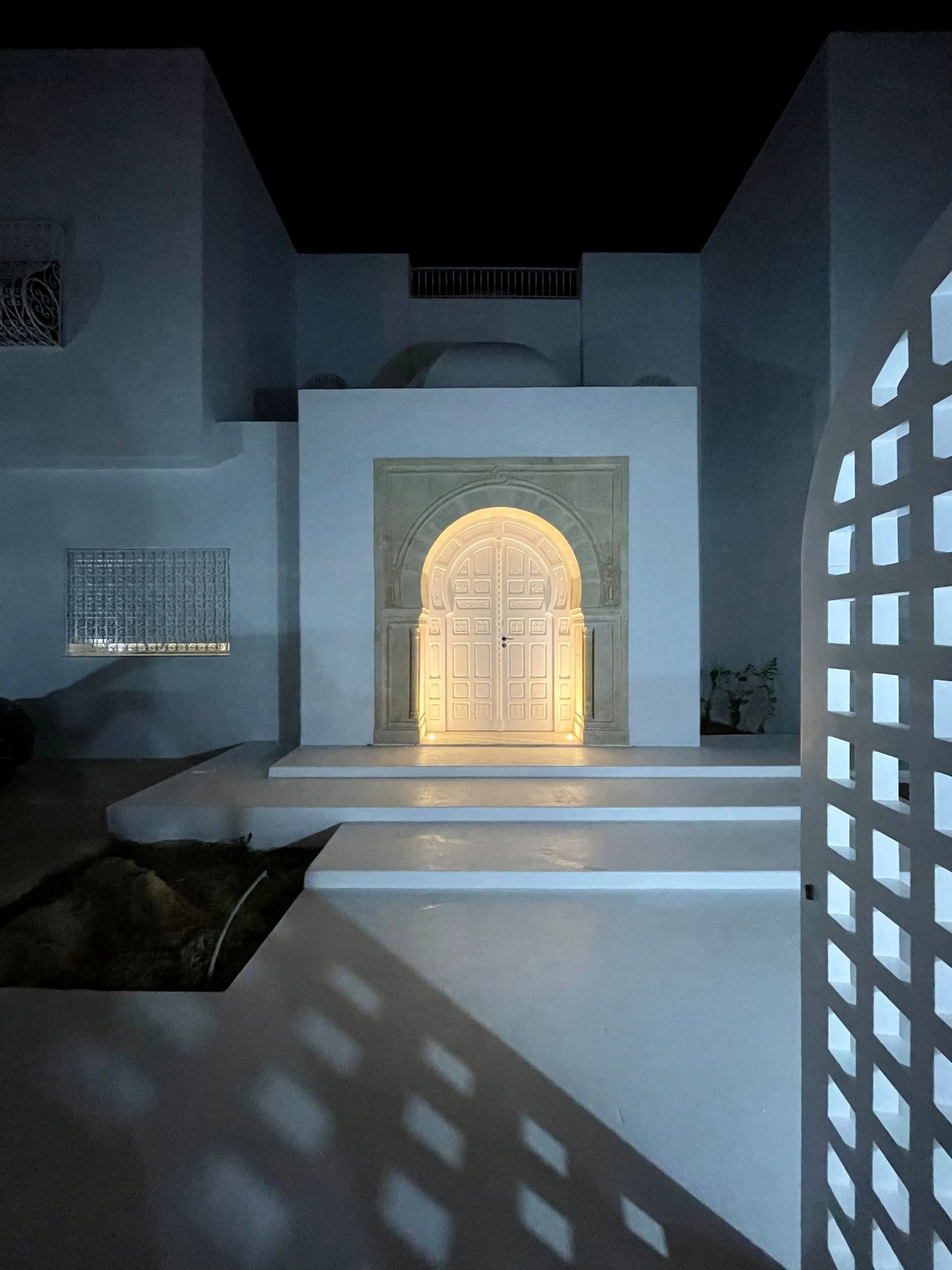 The entrance door lit up at night